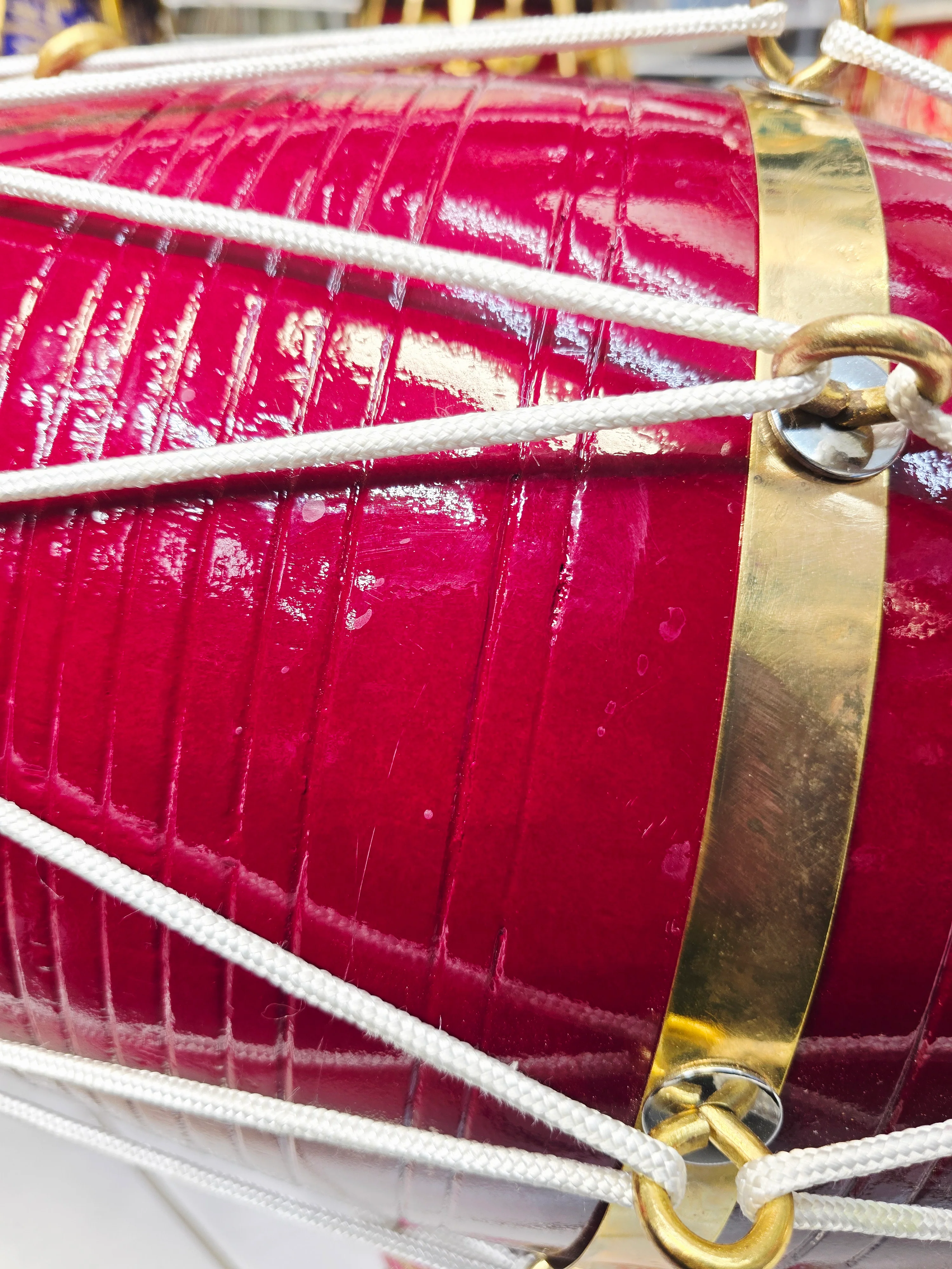 Crimson Relay – West Indian Dholak
23.25″ Length | 17.2 lbs Solid Red Sheesham | *Exceptional Tone *Minor Cosmetic Blemishes - Image 7